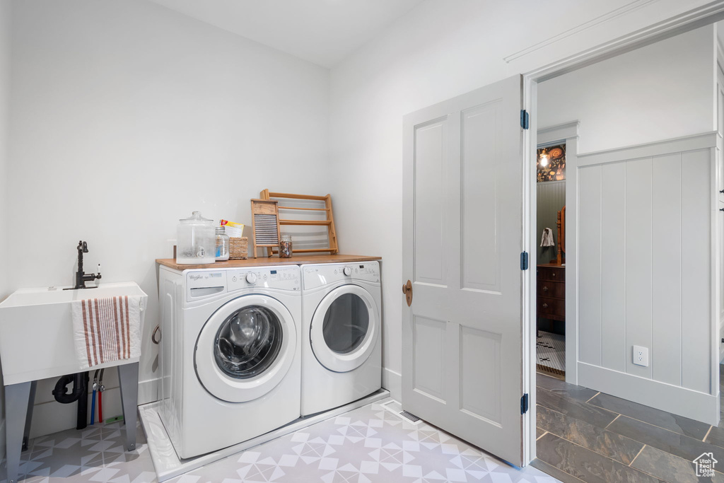 Laundry area featuring washer and clothes dryer and laundry area
