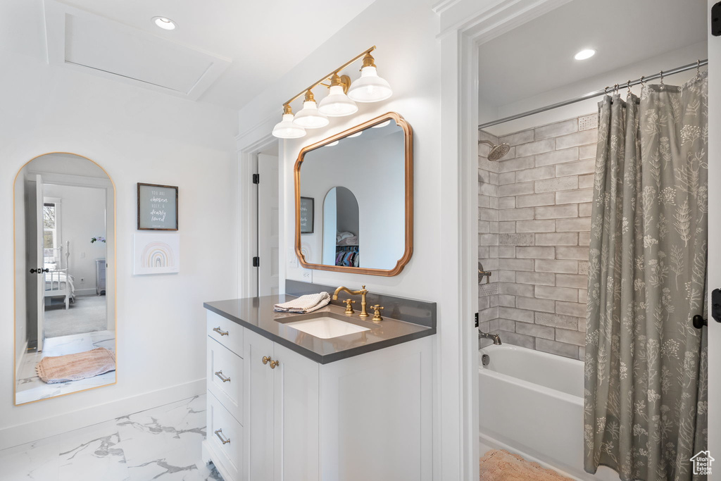 Full bathroom with vanity, marble finish floor, shower / tub combo, baseboards, and recessed lighting