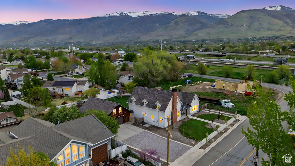 Aerial view at dusk with a residential view and a mountain view