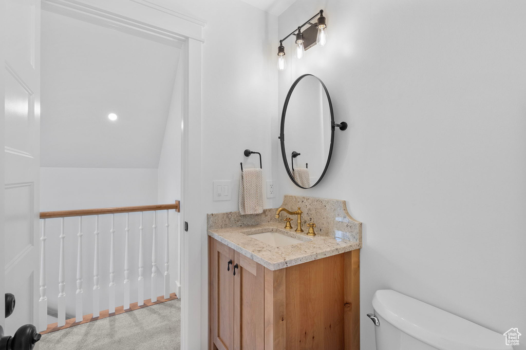 Bathroom featuring vanity and toilet