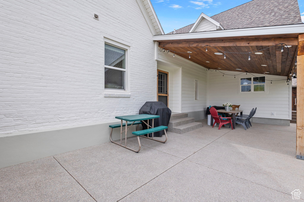 View of patio featuring grilling area and entry steps