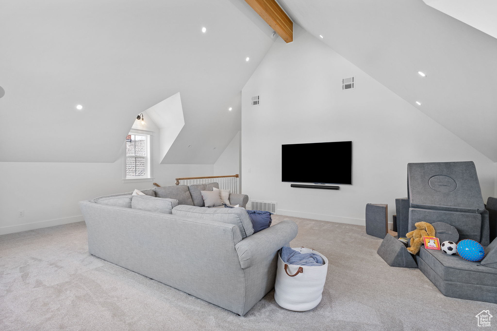 Living room with lofted ceiling with beams, visible vents, carpet floors, and recessed lighting