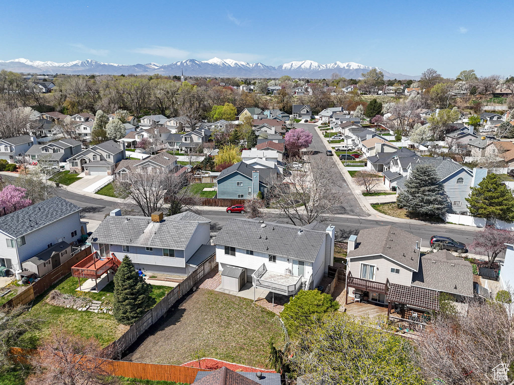 Birds eye view of property with a mountain view and a residential view