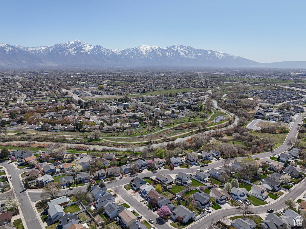 Birds eye view of property with a residential view and a mountain view