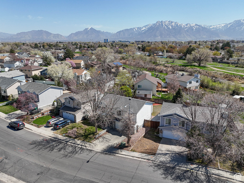 Birds eye view of property featuring a mountain view and a residential view