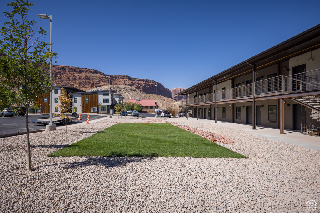 View of property's community featuring a yard and a mountain view
