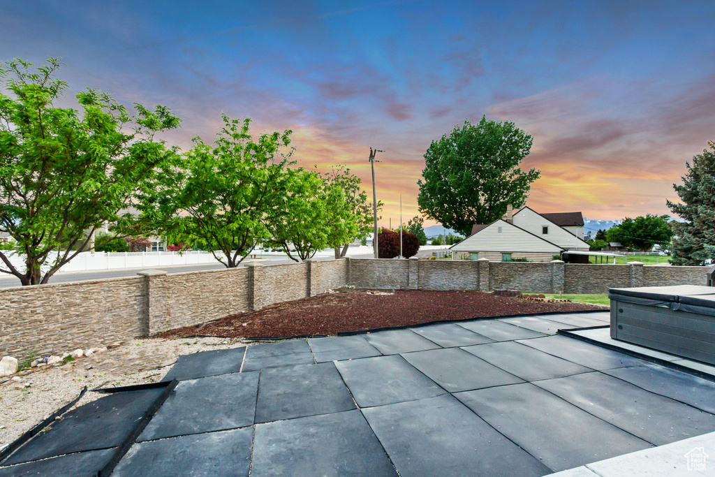 View of patio / terrace featuring a hot tub and a fenced backyard