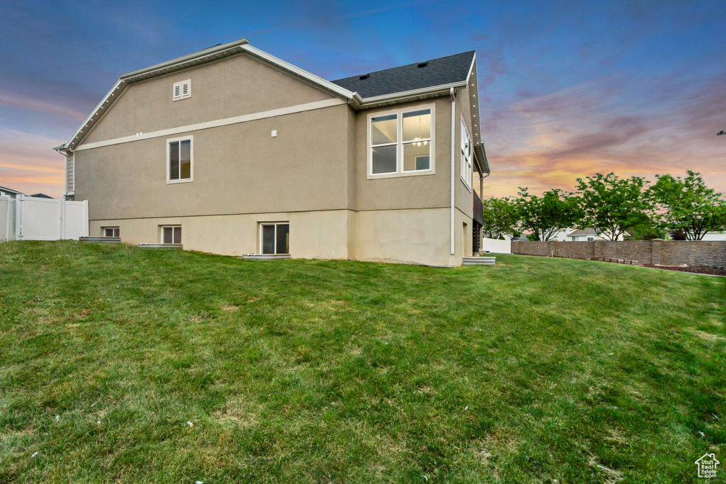 Rear view of property featuring stucco siding