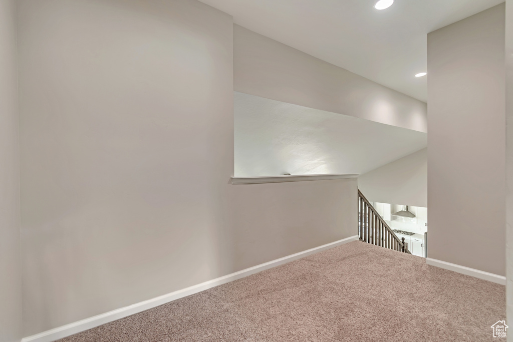 Spare room featuring carpet floors, recessed lighting, and baseboards