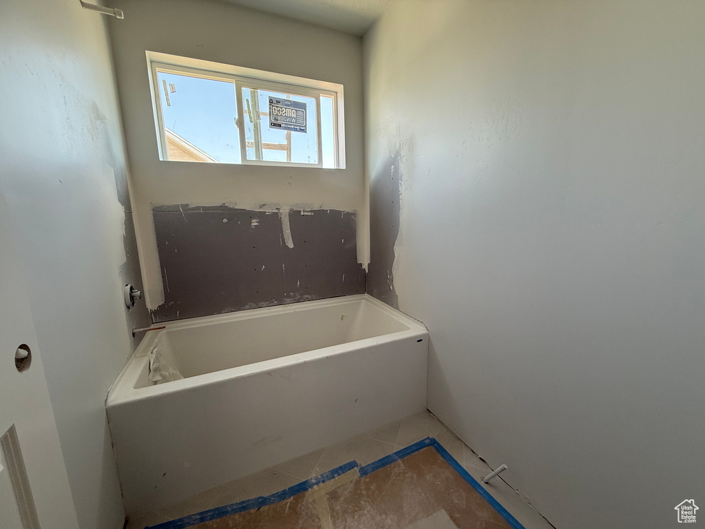 Full bathroom with a bathtub