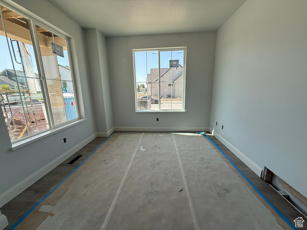 Unfurnished room with baseboards