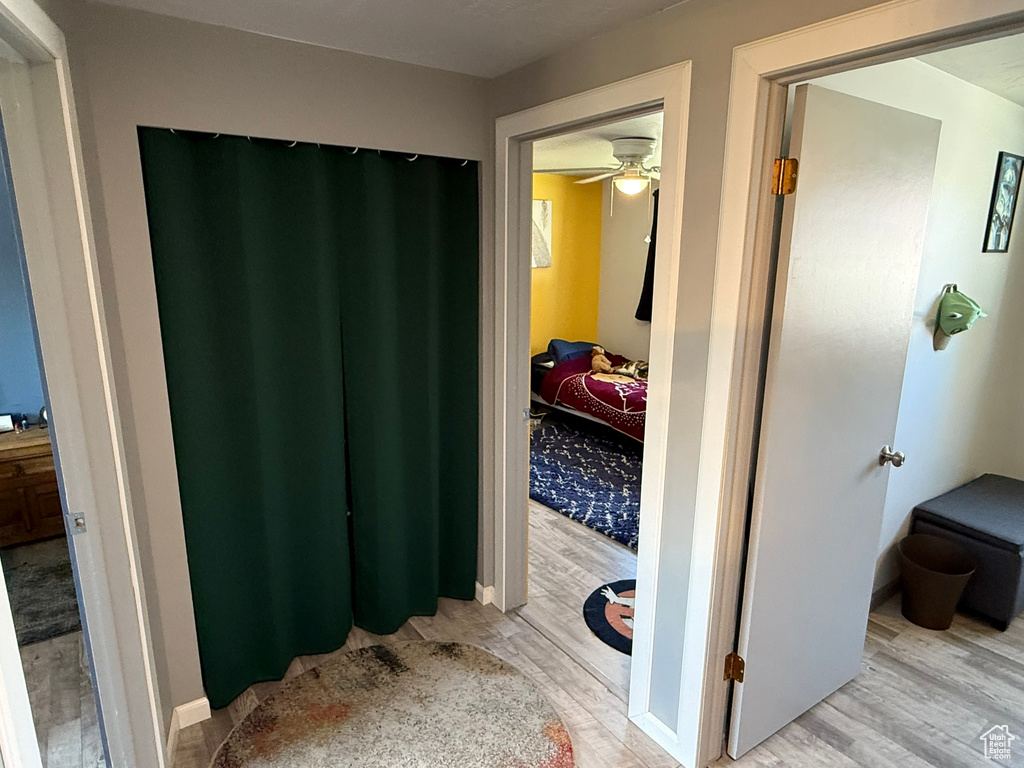 Hallway featuring light wood finished floors