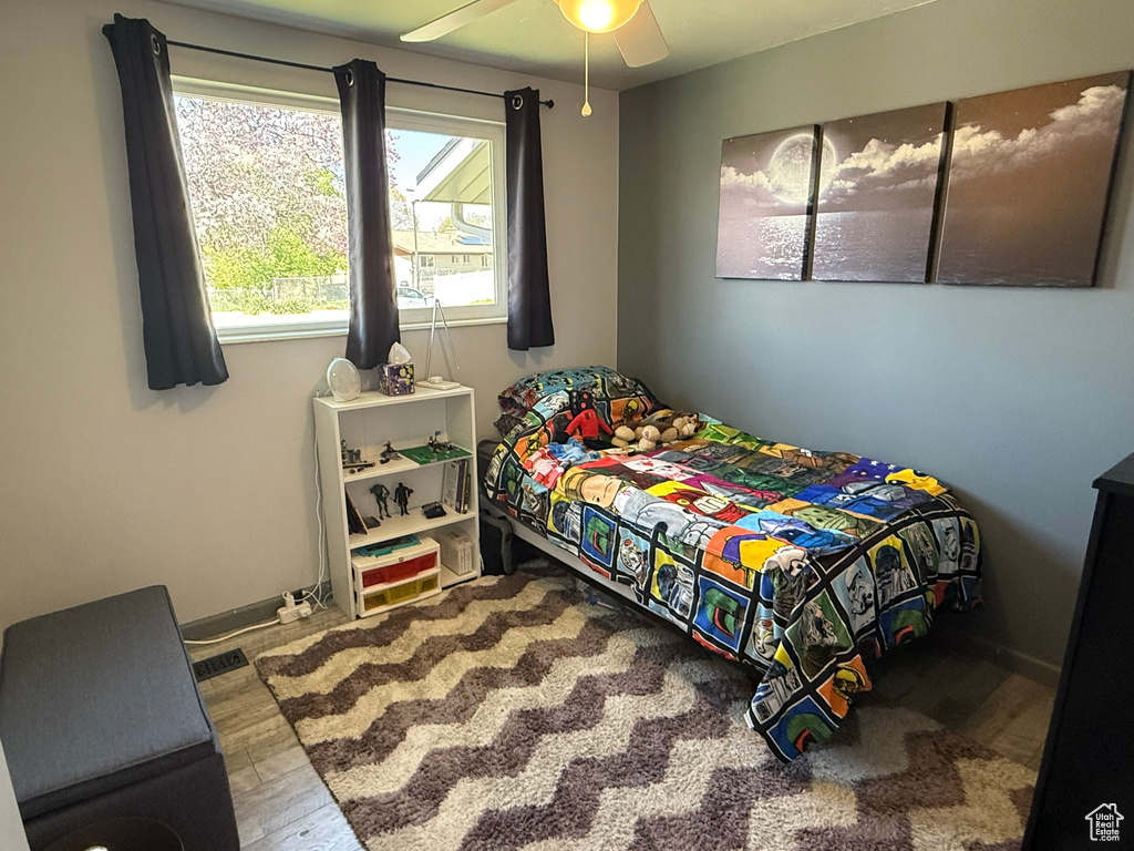 Bedroom featuring a ceiling fan and wood finished floors