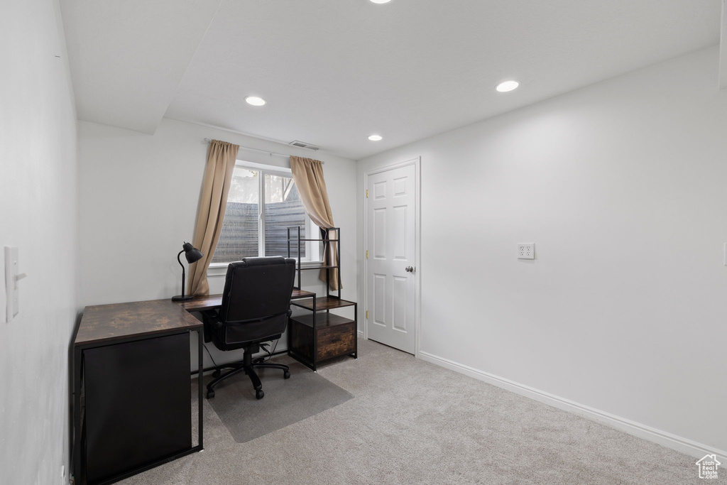 Office with recessed lighting, carpet floors, visible vents, and baseboards