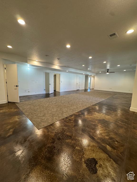 Below grade area featuring baseboards, recessed lighting, and ceiling fan