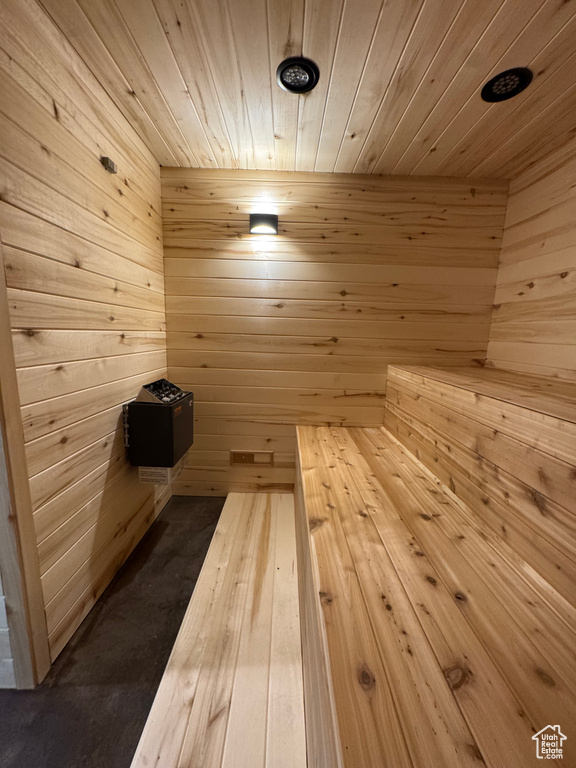Sauna with wooden ceiling and wood walls