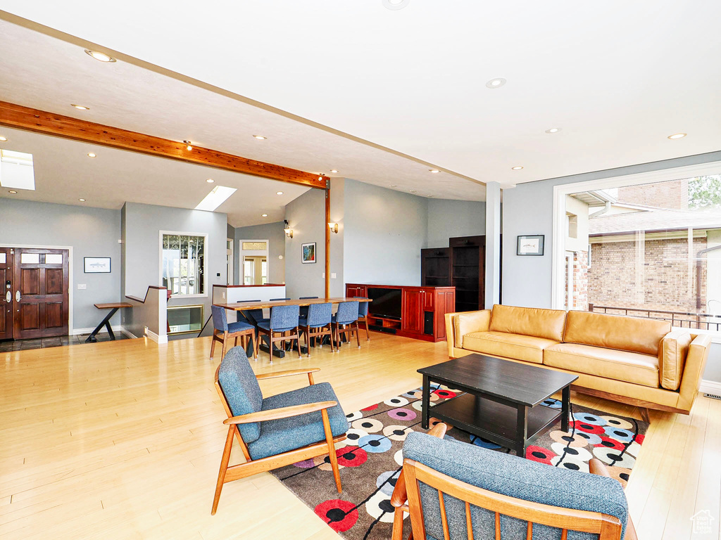 Living room featuring wood finished floors, recessed lighting, and baseboards