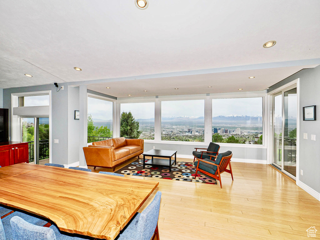 Dining area with wood finished floors, recessed lighting, and baseboards