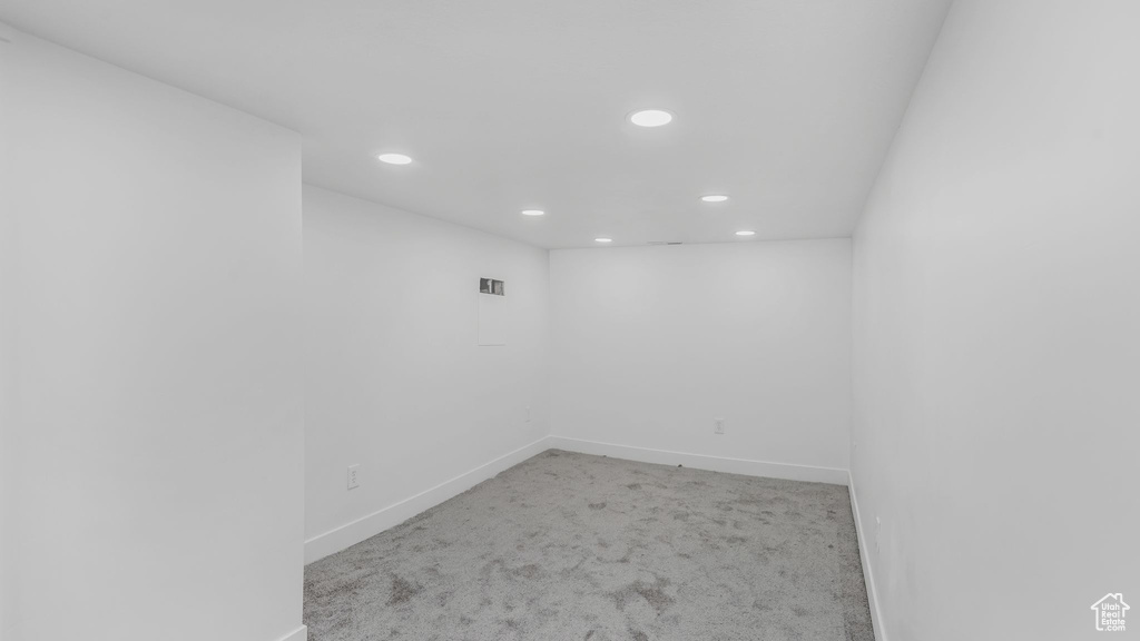 Empty room with recessed lighting, carpet, and baseboards