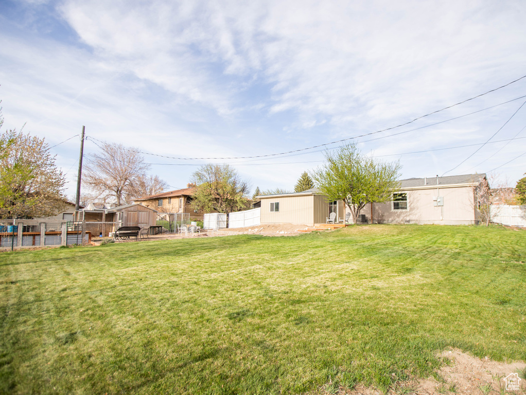 View of yard featuring fence