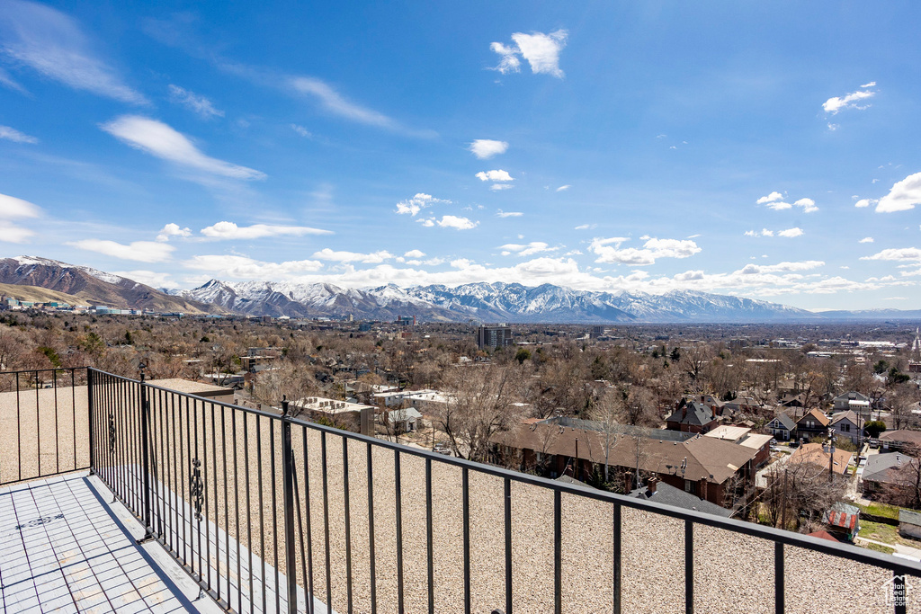 Balcony featuring a mountain view and a residential view