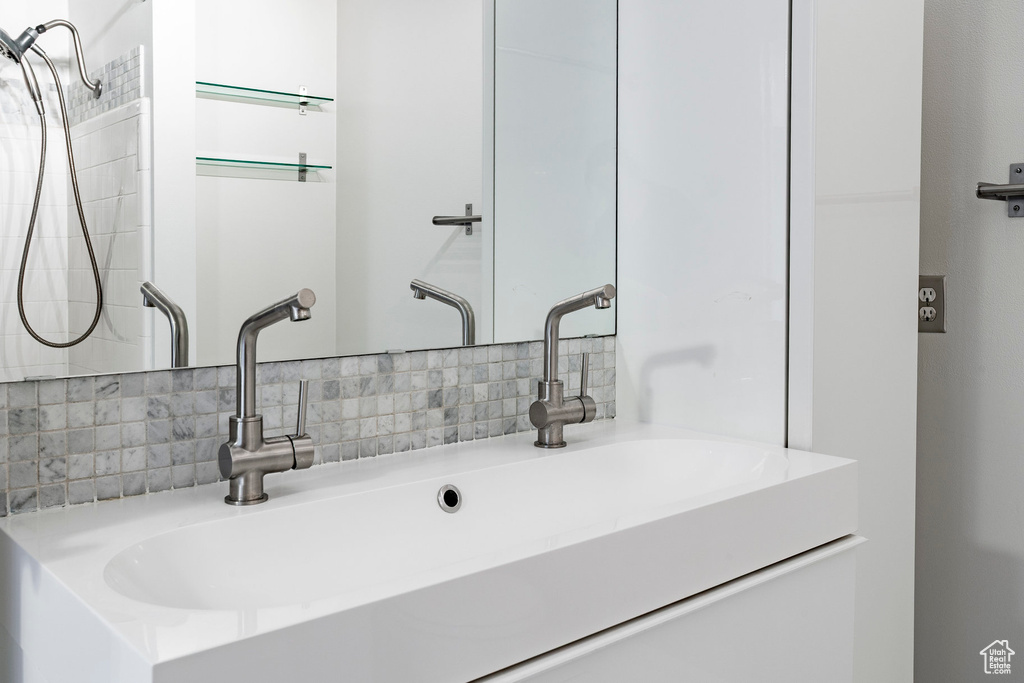 Bathroom with backsplash and vanity