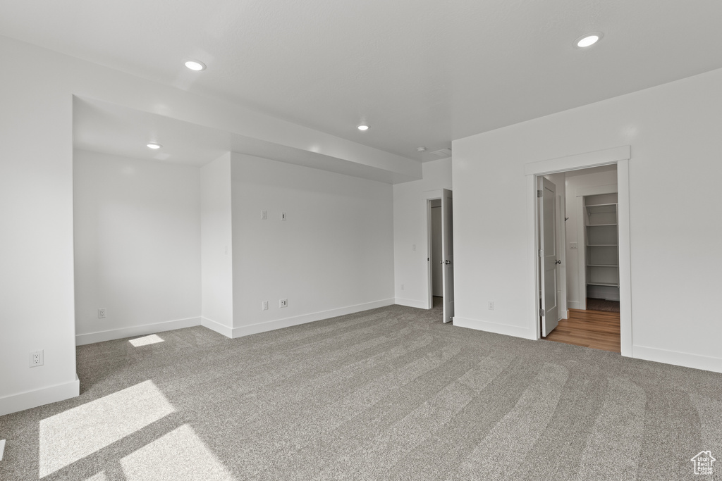 Interior space featuring baseboards, carpet flooring, and recessed lighting