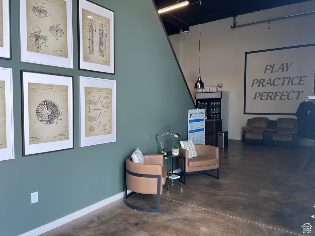 Interior space featuring concrete flooring and baseboards