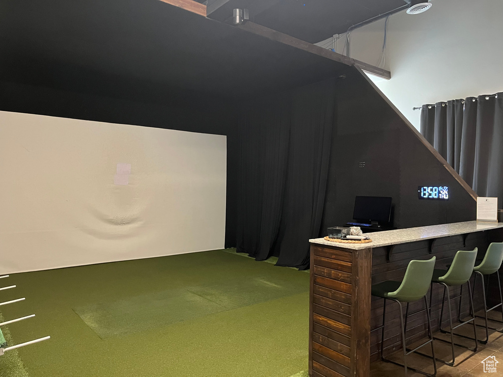 Game room with carpet flooring and golf simulator