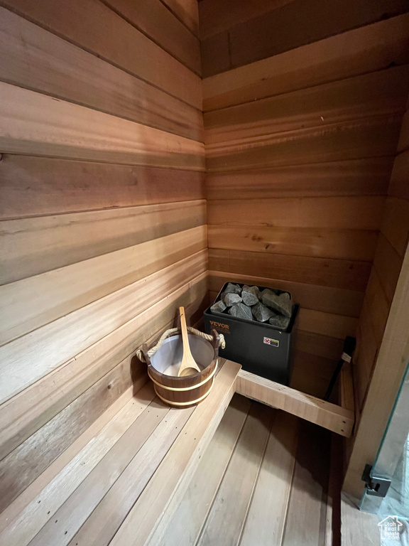 Relaxing sauna featuring wood walls