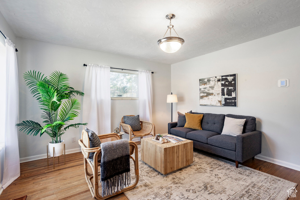 Living area with light wood-type flooring and baseboards