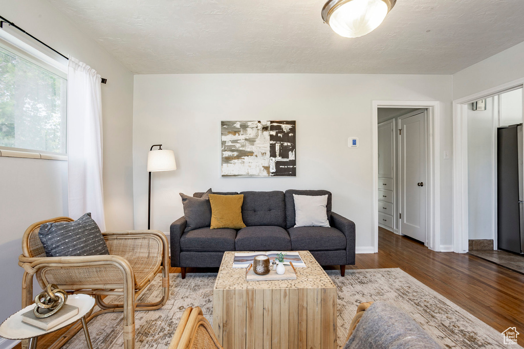 Living area featuring wood finished floors and baseboards
