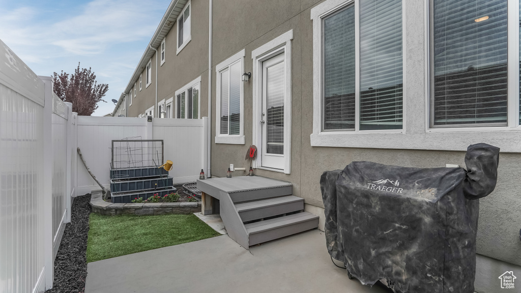 View of patio with fence