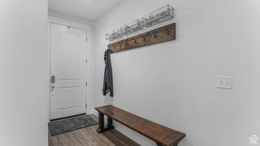 Mudroom featuring baseboards and wood finished floors