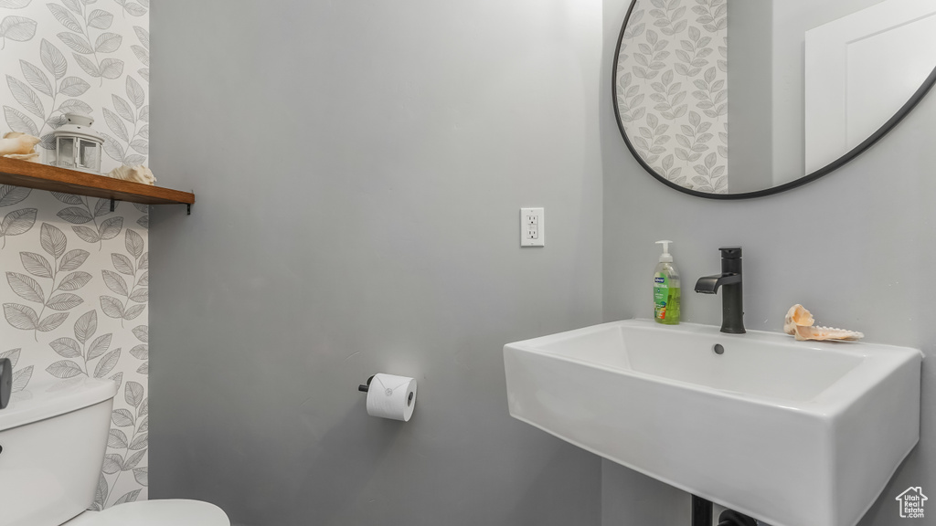 Bathroom with a sink and toilet