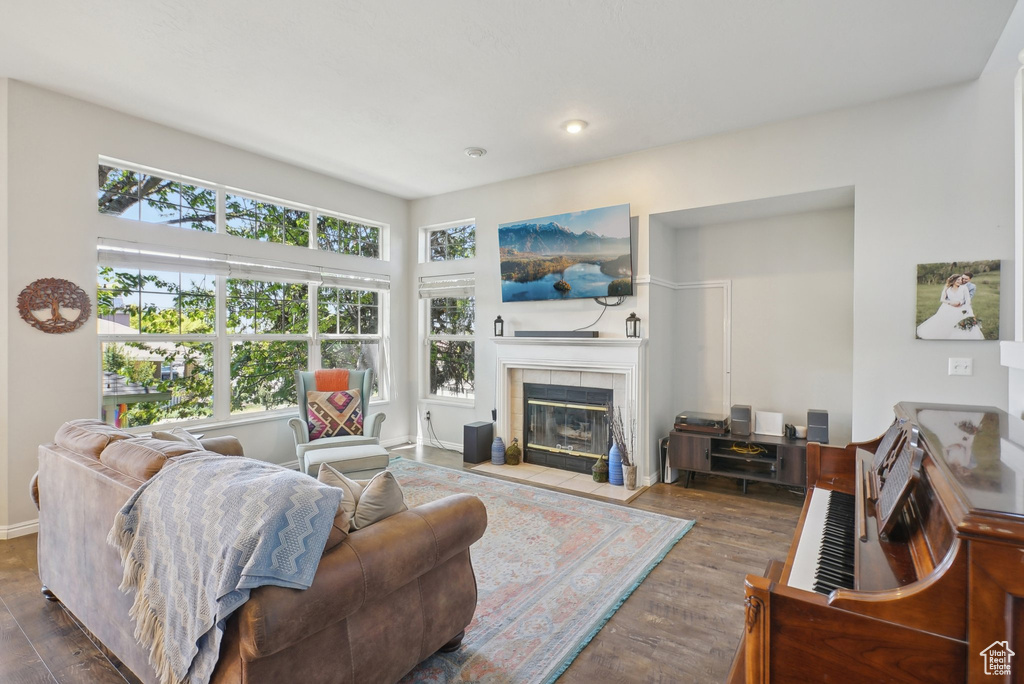 Living area with wood finished floors and a fireplace