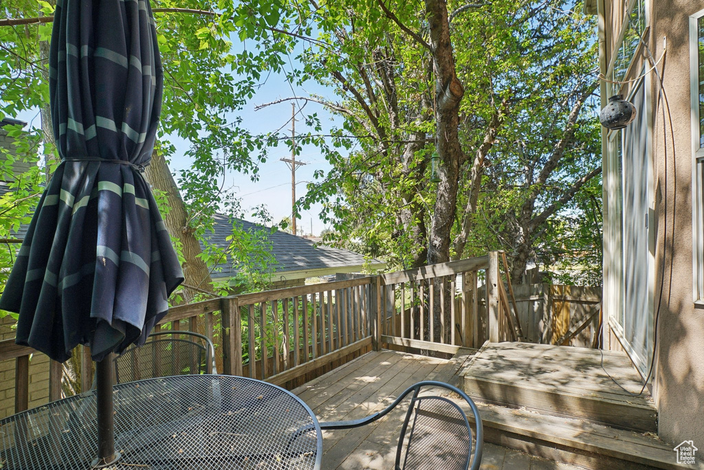 Wooden deck featuring outdoor dining area