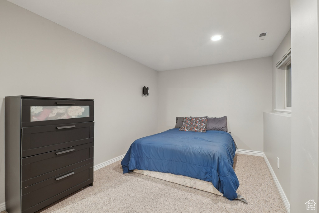 Bedroom featuring recessed lighting, baseboards, and light colored carpet