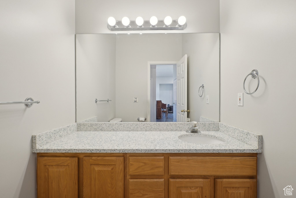 Bathroom with vanity and toilet