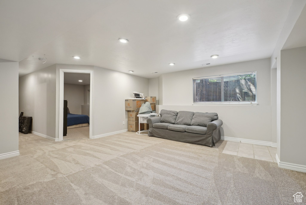 Living room with recessed lighting, carpet flooring, and baseboards