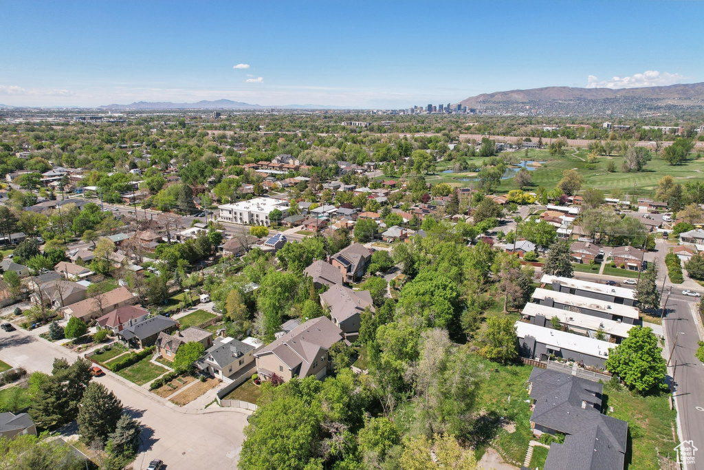 Birds eye view of property with a mountain view and a residential view