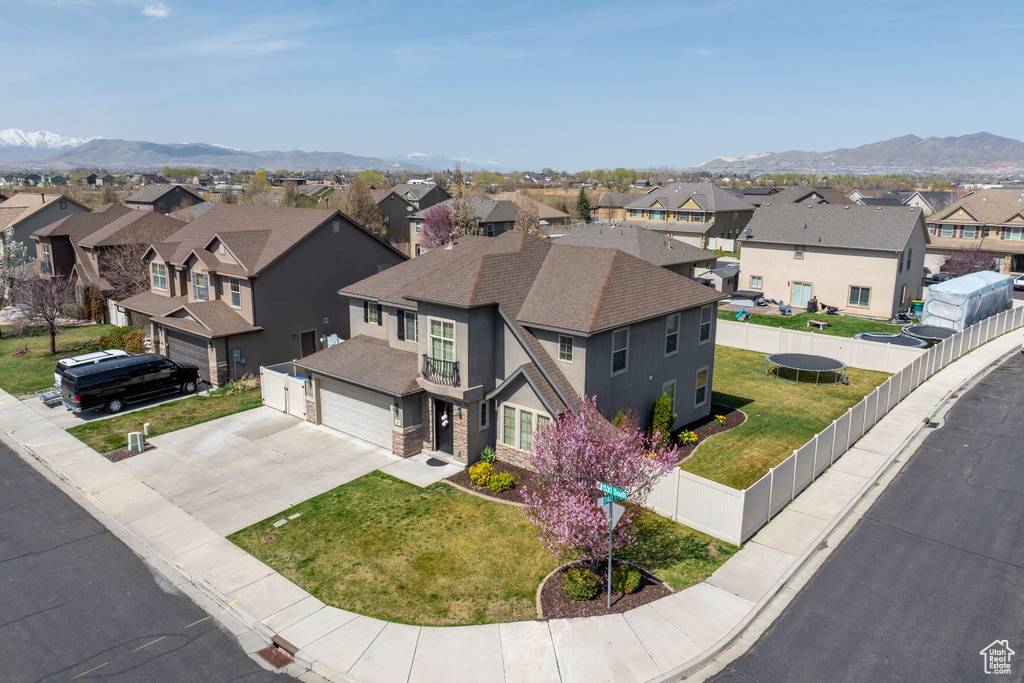 Drone / aerial view with a residential view and a mountain view