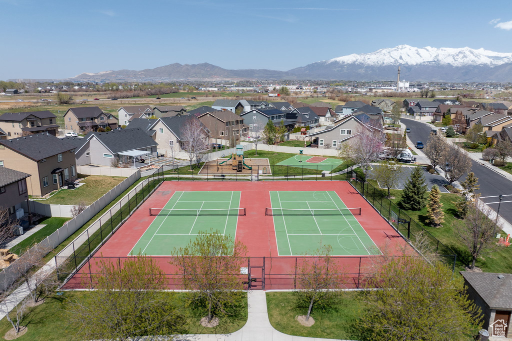 Birds eye view of property with a mountain view and a residential view