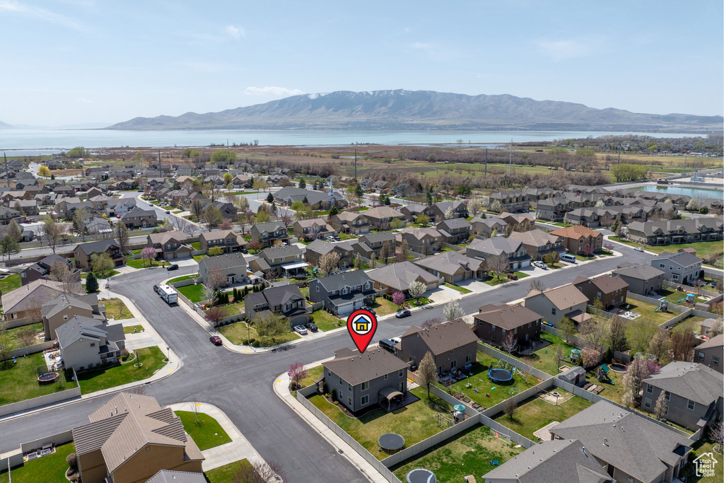 Drone / aerial view featuring a residential view and a water and mountain view
