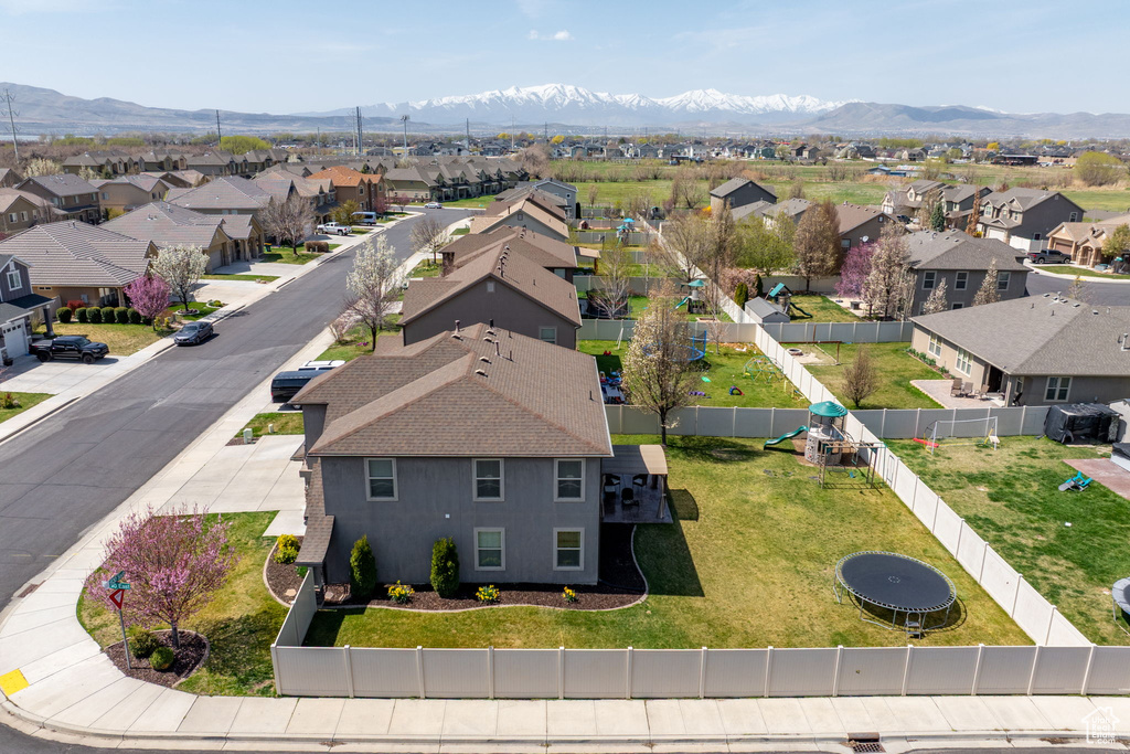 Drone / aerial view with a residential view and a mountain view