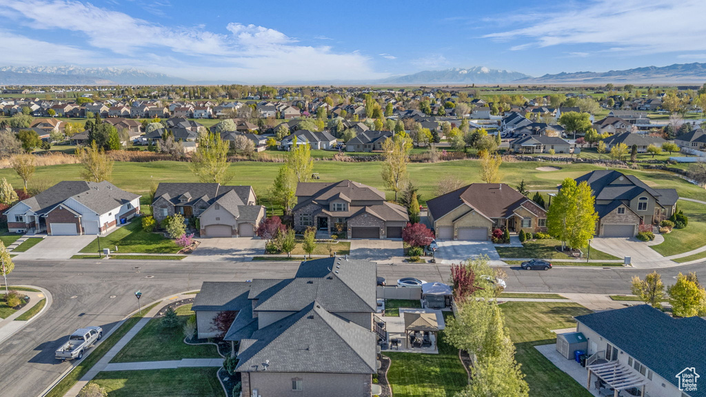 Aerial view of residential area featuring a mountainous background