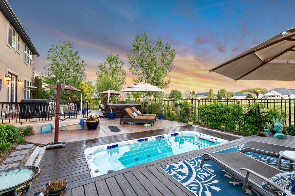View of swimming pool featuring a wooden deck