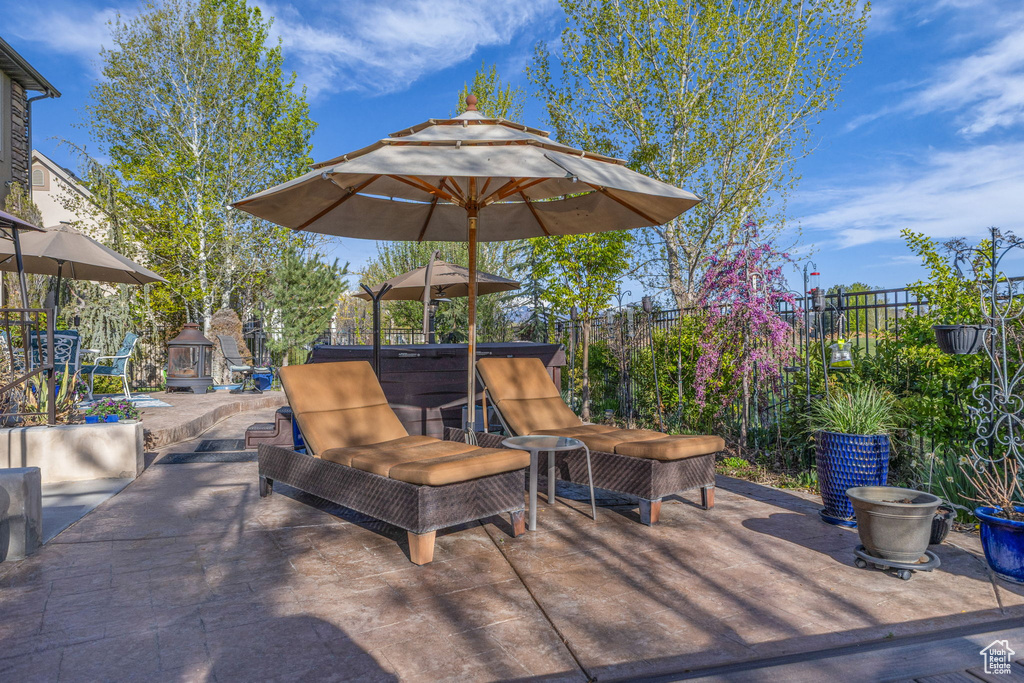 Fenced backyard with a patio area