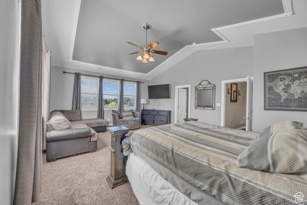 Bedroom with carpet, lofted ceiling, a ceiling fan, and attic access