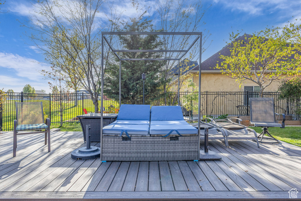 Wooden terrace featuring an outdoor living space